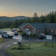 Vermont State Police officers at Shaftsbury Barracks with police vehicles and c — Vermont State Police Shaftsbury Barracks