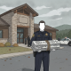 A police officer holding a bundle of logs outside the Vermont State Police Shaftsbury Barracks, with officers in the backg…