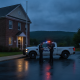 Two police officers discussing near a police vehicle outside the Shaftsbury Barrac — Shaftsbury Barracks DUI investigation