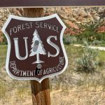 Sign for the U.S. Forest Service, Department of Agriculture, with a mountainou — US Forest Service headquarters relocation