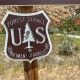 Sign for the U.S. Forest Service, Department of Agriculture, with a mountainou — US Forest Service headquarters relocation