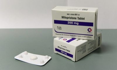 Mifepristone tablets in packaging, representing abortion pill restrictions and telehealth laws.