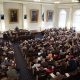 A packed legislative chamber with numerous attendees and officials, highlig — state legislative races competitive chambers