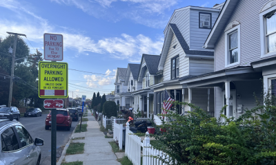 Rockland County Murder Trial Witness story context: quiet residential street with parked cars, homes, and parking signs