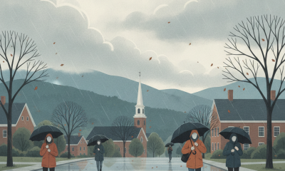 People walking with umbrellas on a rainy street in Bennington, Vermont, with overcast ski — Bennington VT weather forecast