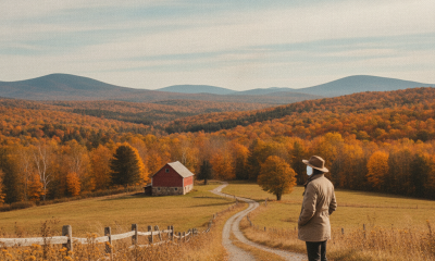 A person stands on a country lane overlooking an autumn valley beneath a cloudy sk — Bennington County VT weather forecast