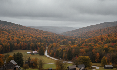 Two people walking on a path through a colorful autumn landscape in Bennington Valley und — Bennington VT weather forecast