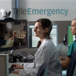 Healthcare professionals monitor patients through telemedicine screens in a clinic — September jobs report hiring slowdown