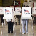 Trump DOJ election subpoenas story illustration: voters cast ballots at private voting booths marked with American flags.