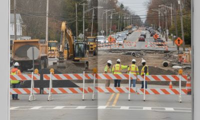 Construction workers in safety vests manage roadwork with heavy machinery and traffic ba — Bennington VT Road Construction