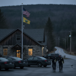 Two Vermont State Police officers walk near their barracks in Shaftsbury, V — Shaftsbury VT domestic assault investigation