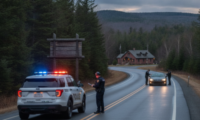 Vermont State Police Shaftsbury Barracks excessive speed stop on a rural road, with an officer beside a patrol SUV and a c…