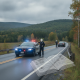 Vermont State Police Shaftsbury Barracks excessive speed scene with a patrol car, officers, and a stopped vehicle on a rur…